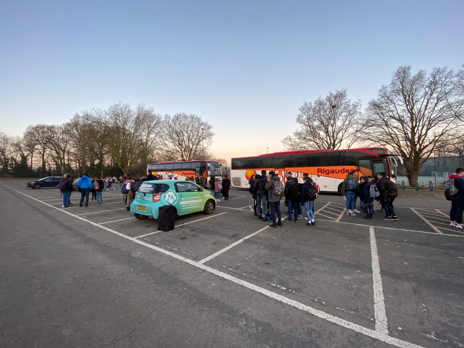 Two coaches and students at the Norman Park meeting point in Bromley
