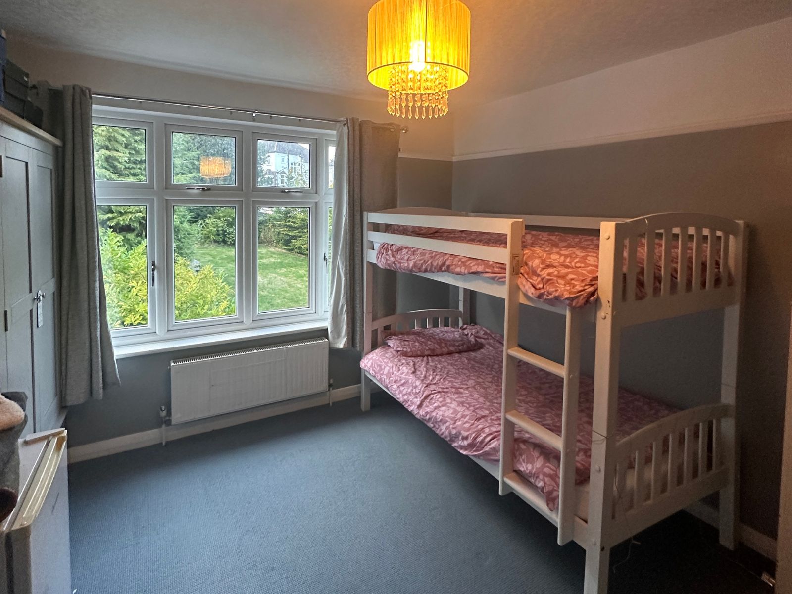 A twin student bedroom overlooking the garden in a West Wickham host home